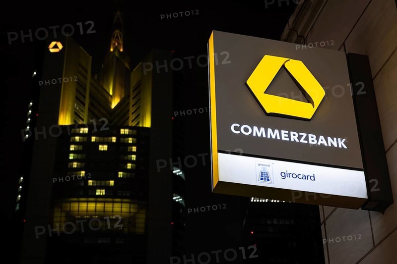 A yellow heart glows on the façade of the Commerzbank Tower in Frankfurt am Main at Christmas time in the evening, Frankfurt am Main, Hesse, Germany