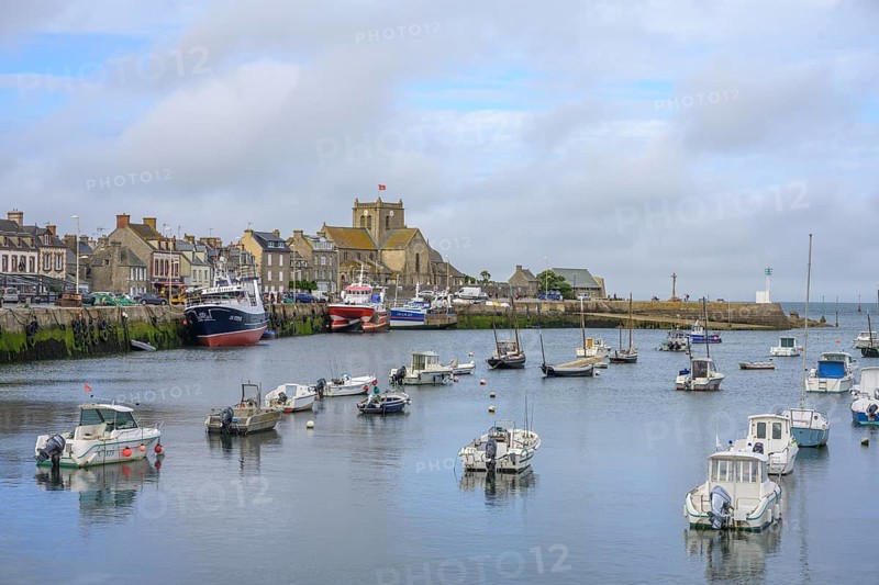 Boats are moored in harbor at low tide, Barfleur, Manche department, France