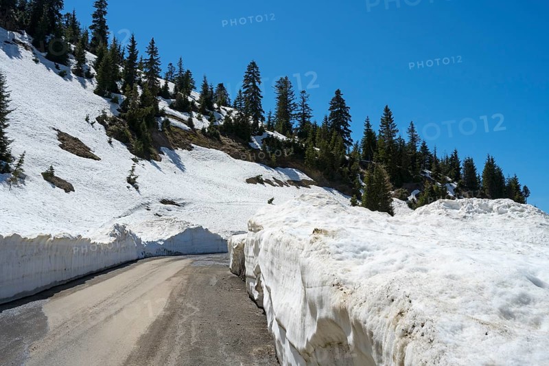 A mountain road lined with high snow walls offers an impressive winter landscape, near Goderdzi on the way to the Goderdzi Pass, Ajara region, Adjara, autonomous republic, Georgia