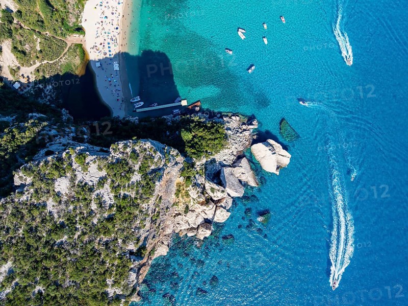 Picturesque rocky coast, cliffs and Cala Luna beach, aerial view, top-down, Golfo di Orosei, Baunei, Sardinia, Italy