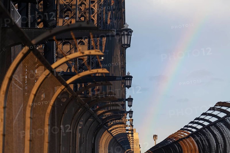 Details of the famous Sydney Harbour Bridge in the evening light with a rainbow. New South Wales, Australia