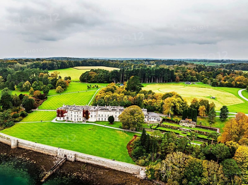 Autumn over Plas Newydd House from a drone, Gardens and Parkland, Llanfairpwllgwyngyll, Anglesey, Wales, UK