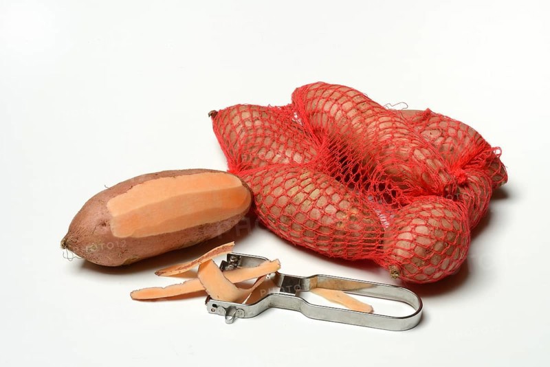 Sweet potato with potato peeler, Ipomoea batatas
