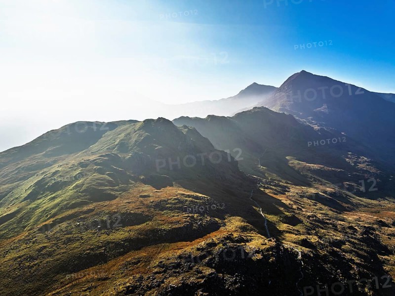 Autumn colours of Pen-y-Pass over Miner's Track, Start Point and road A4086 from a drone, Snowdonia, Wales, UK