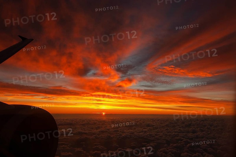 View from airplane window at sunrise