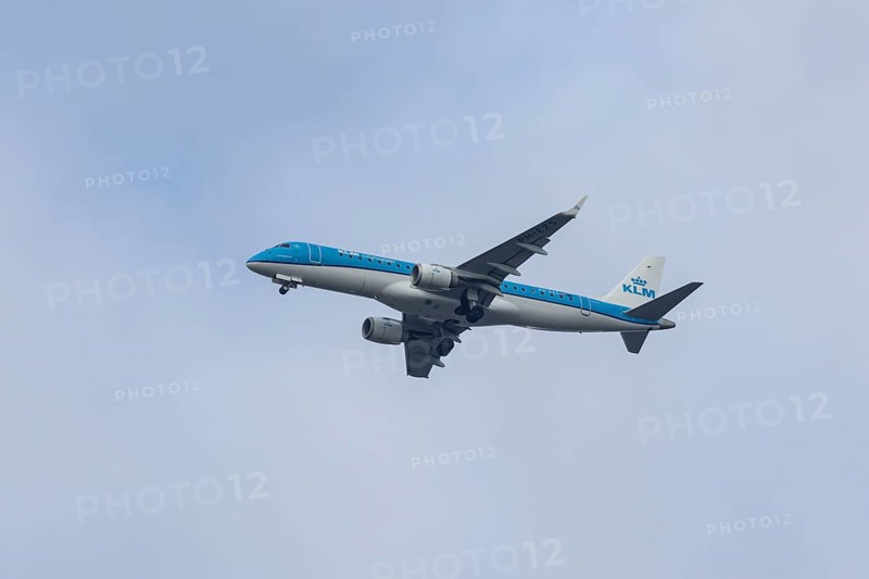 Embraer ERJ-190 jet passenger aircraft of Royal Dutch KLM cityhopper airlines in flight on approach to London city airport, England, United Kingdom