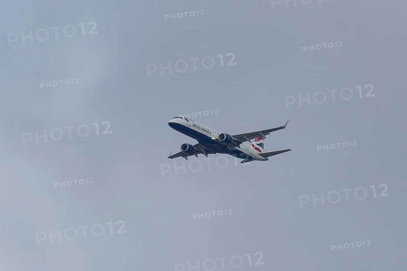 Embraer ERJ-190 jet passenger aircraft of British Airways BA CityFlyer airlines in flight on approach to London city airport, England, United Kingdom