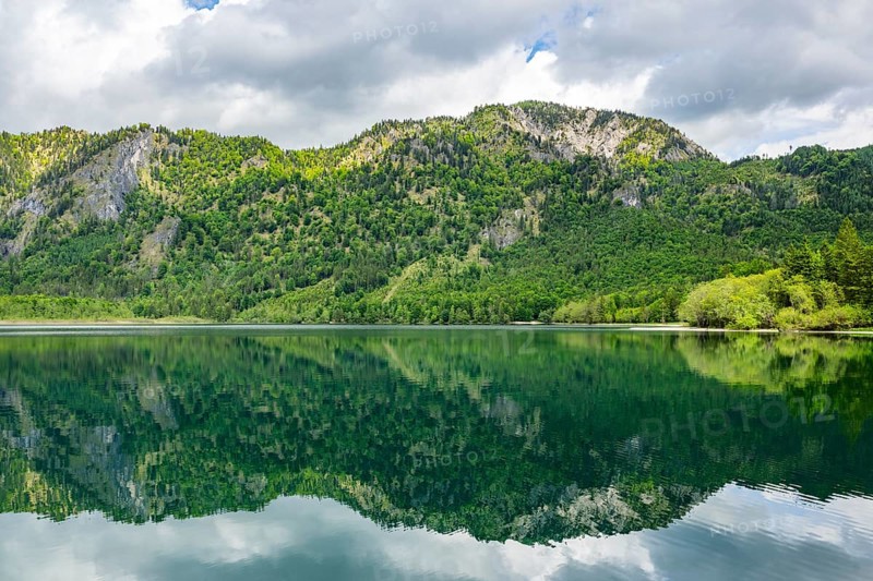 Landscape of Lake Offensee after rain when the sun comes through the clouds in spring, Salzkammergut, Austria