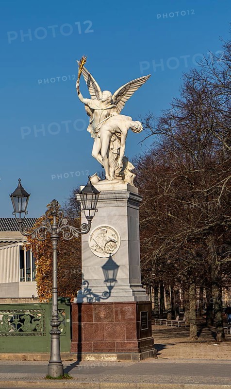 The shadow of a street lamp on the pedestals of the group of figures on the Schlossbrücke, Unter den Linden, Berlin, Germany