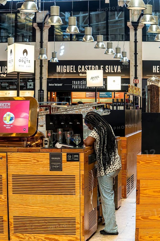 The Mercadeo da Ribeira, also known as TimeOut Market, is the best address for Portuguese specialties and international cuisine. Historic market hall at Cais do Sodré station, Lisbon, Portugal