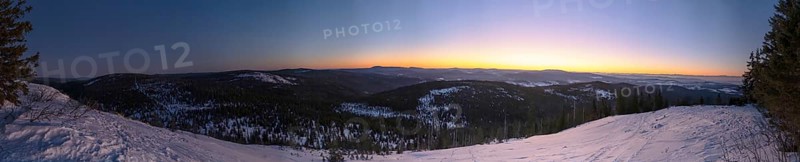 View from Mount Lusen over the hills of the bavarian forest at sunrise in winter, Bavaria, Germany