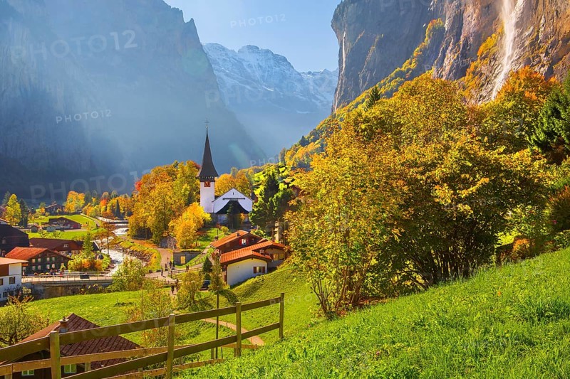 View of town and valley with Staubbach waterfall in autumn, Lauterbrunnen, Bernese Oberland, Canton of Bern, Switzerland