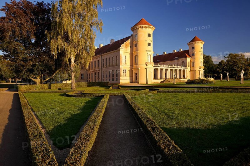Rheinsberg Castle, front in late evening light, prime example of Friederician Rococo, Ruppiner Land, Brandenburg, Germany