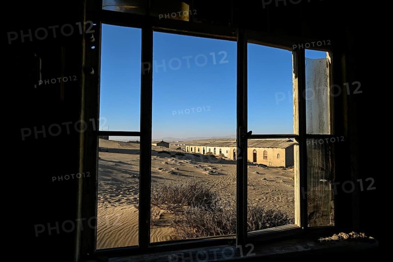 View from a former dwelling house into the desert, Kolmanskop, restricted diamond area, Karas region, Namibia