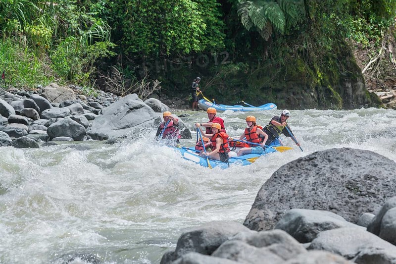 A group of people white water rafting, Costa Rica, Central America