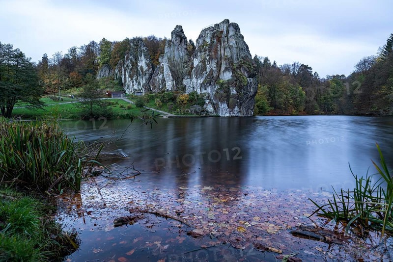 Externsteine in autumn, view over the Wiembecke pond, Teutoburg Forest, Horn-Bad Meinberg, North Rhine-Westphalia, Germany