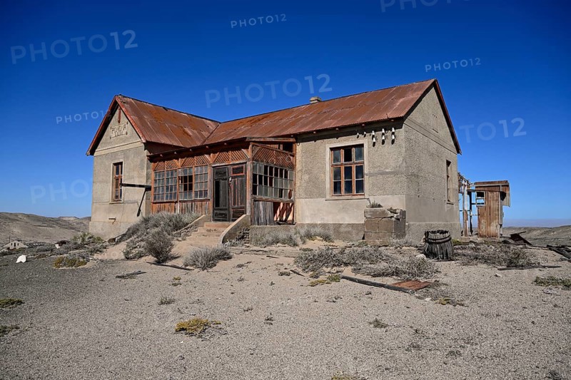 Dilapidated building in the desert sand, Pomona, restricted diamond area, near Lüderitz, Karas region, Namibia