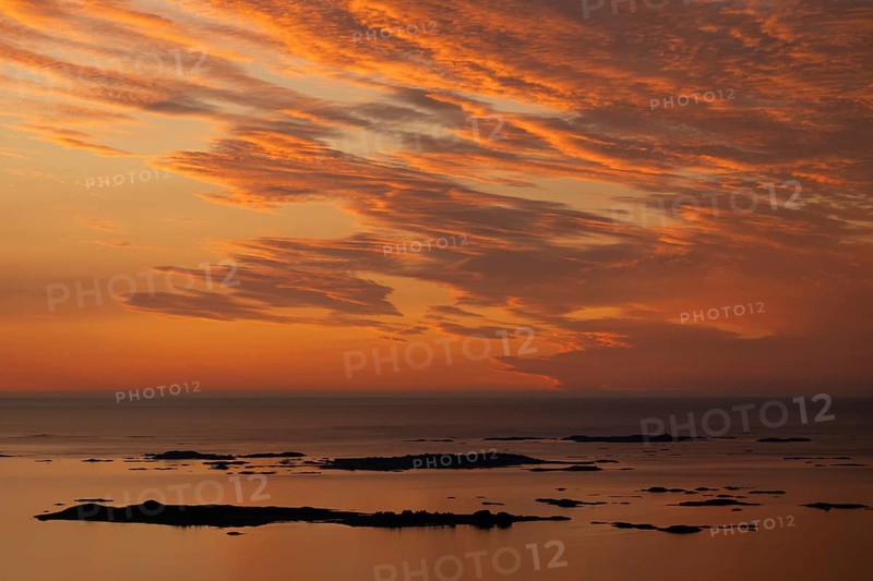 Offshore islands and skerries, sea, dramatically illuminated clouds, sunset, Otroya or Otrøya island, Møre og Romsdal, Norway