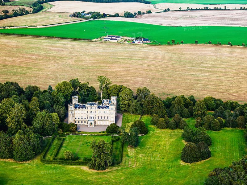 Wedderburn Castle and Barns over fields from a drone, Duns, Berwickshire, Scotland, UK