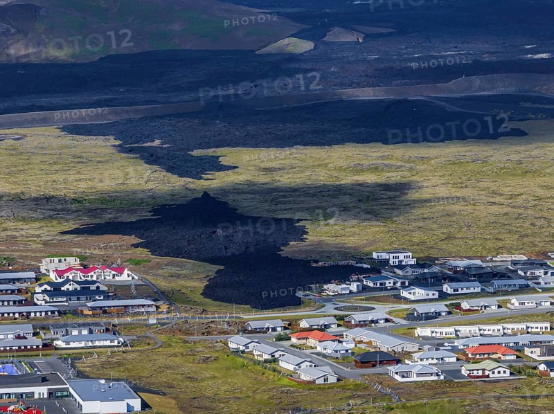 Lava, lava field, village, houses, summer, cloudy, sunny, aerial view, volcanic eruption, July 2025, Grindavik, Sundhnúkur crater series, Fagradalsfjall, Reykjanes, Iceland