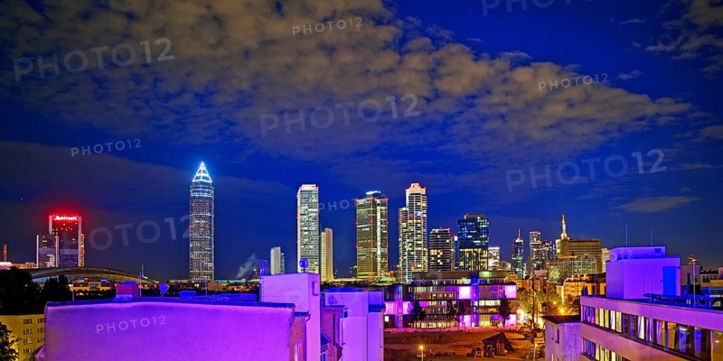 Rooftop day with colourfully illuminated houses for a techno party on the roof with a view of the skyline, Frankfurt am Main, Hesse, Germany