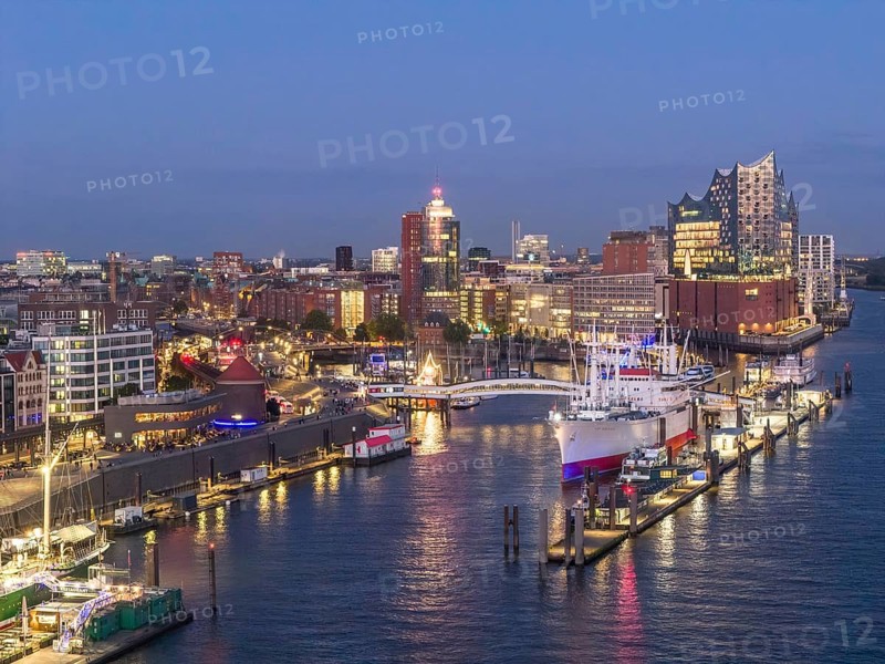 Aerial view of the Landungsbrücken Hamburg (Jan-Fedder-Promenade) at blue hour with Elbe, Cap San Diego and Elbphilharmonie in the background, Hamburg, Germany