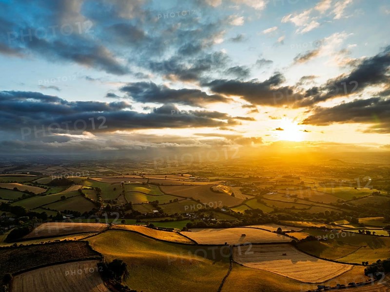 Sunset of Fields and Farms over Devon from a drone, Torquay, Torbay, Devon, England, United Kingdom
