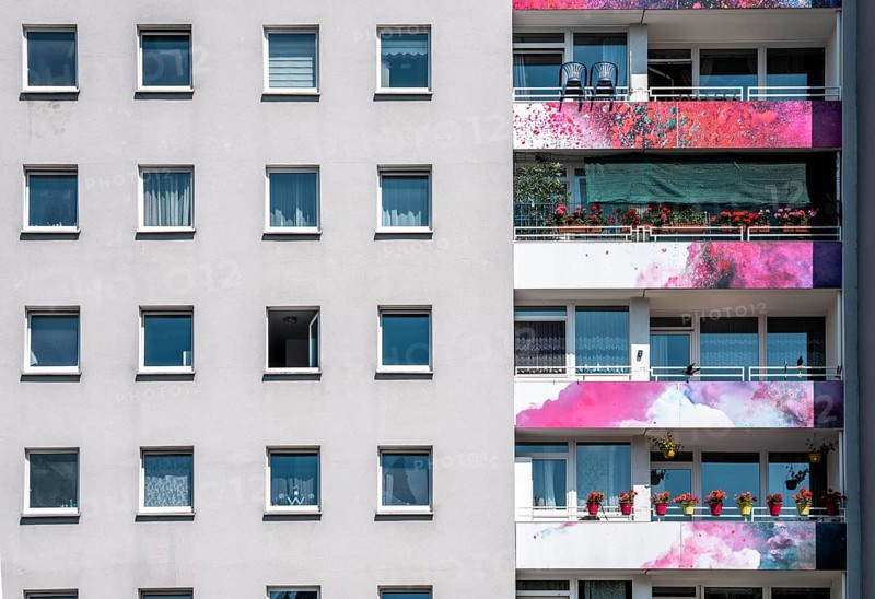 High-rise residential building, in Essen-Steele, with colourfully designed façade, balcony balustrades, after renovation, North Rhine-Westphalia, Germany