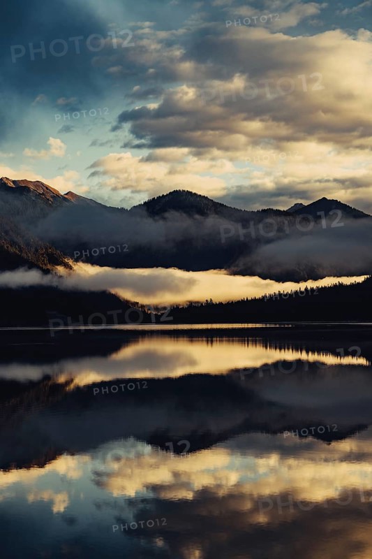 Sunrise with reflections in the Plansee in Tyrol in the Alps in Austria