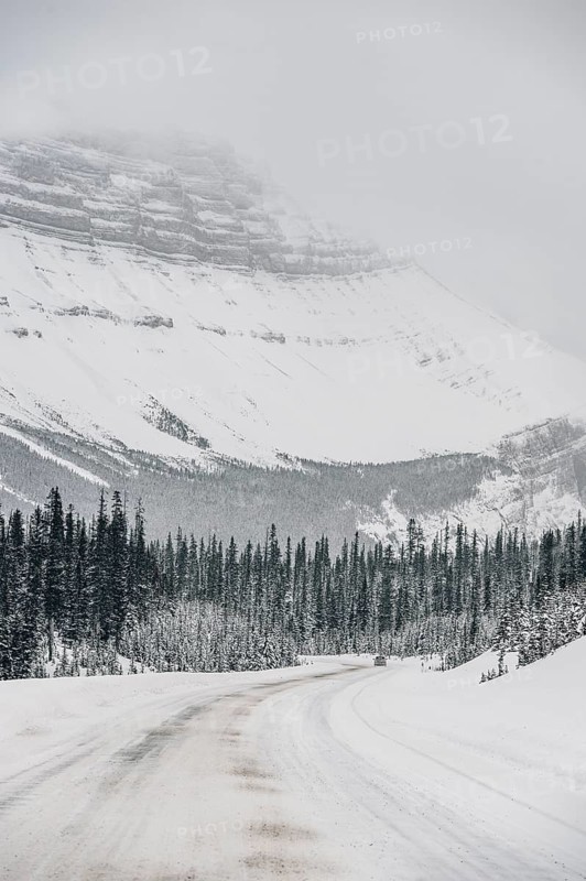 Winter road trip on the Icefields Parkway with lots of snow and ice, Banff National Park, Jasper National Park, Alberta, Canada
