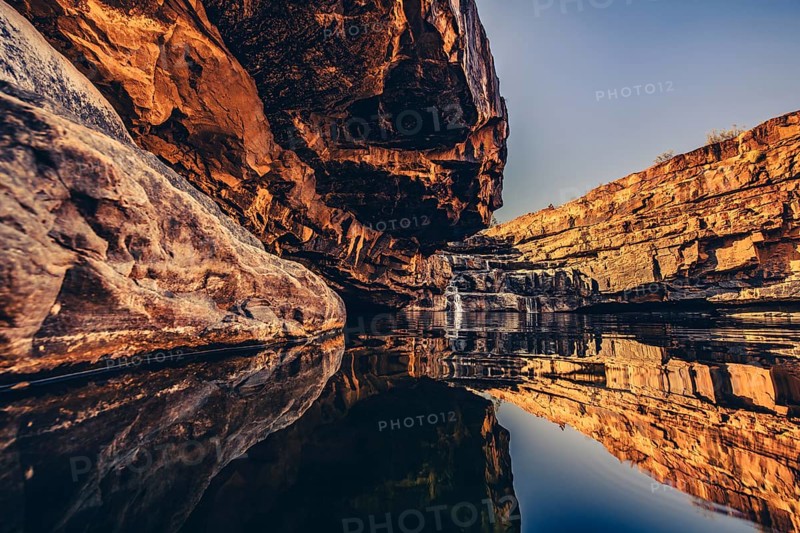 Bell Gorge waterfall, a body of water in north-west Australia in the Kimberley. Sunrise in the outback, Australia