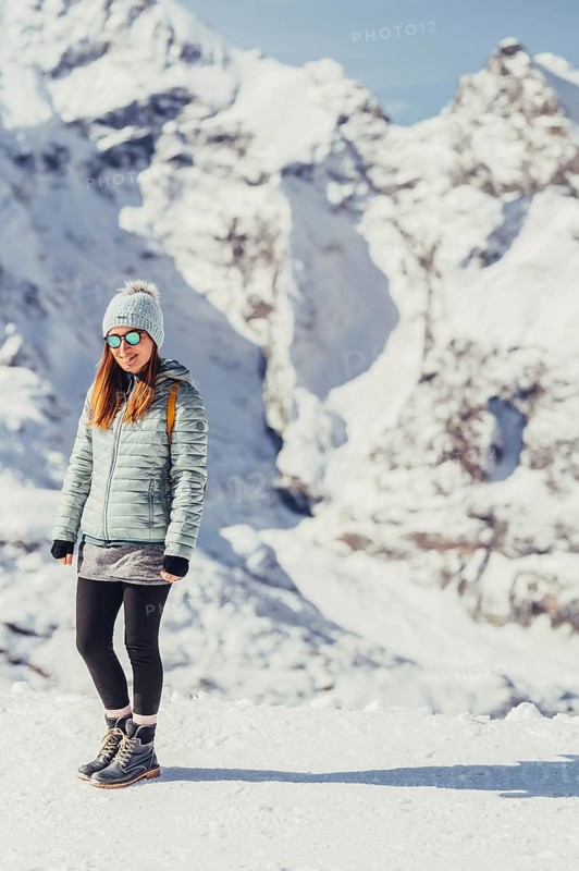 Woman in wintry surroundings in the Engadine in Switzerland