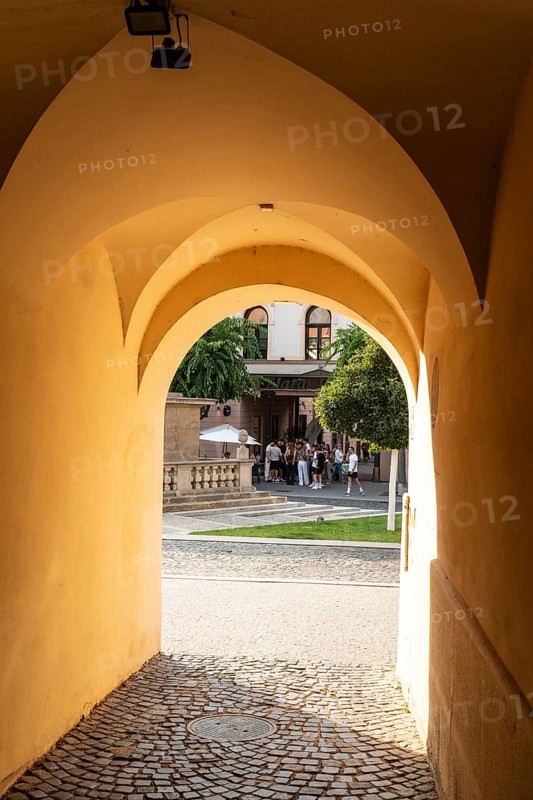 Alley with a view of the square and the Plague Column in the historic centre of the Capital of Culture 2026, Trencín, Slovakia