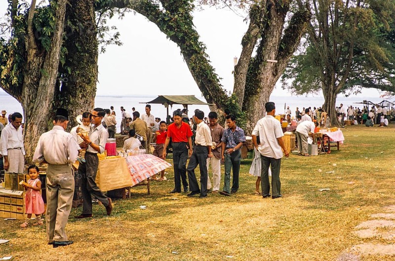 People celebrating having picnics, Waterfront, Johor Bahru, Malaysia, Southeast Asia 1963 - Mawlid festival commemorating the birthday of Islamic prophet Muhammad
