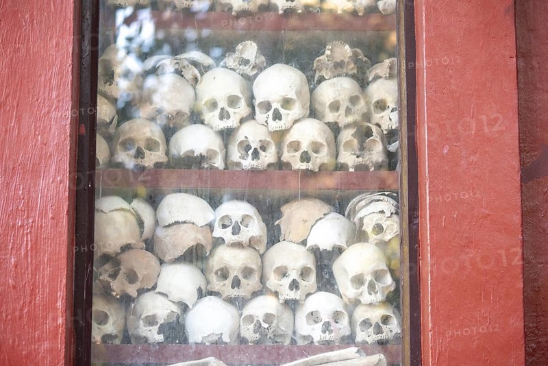 Shrine with human skull, memorial to the victims of the Khmer Rouge regime, Wat Thmei, Siem Reap, Cambodia