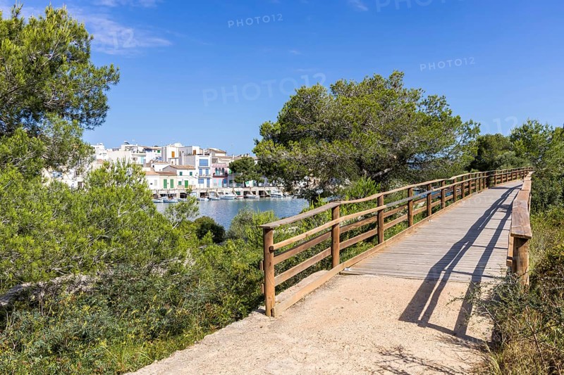Portocolom fishing village on Majorca with boats and colourful houses Holiday by the sea in Portocolom, Spain