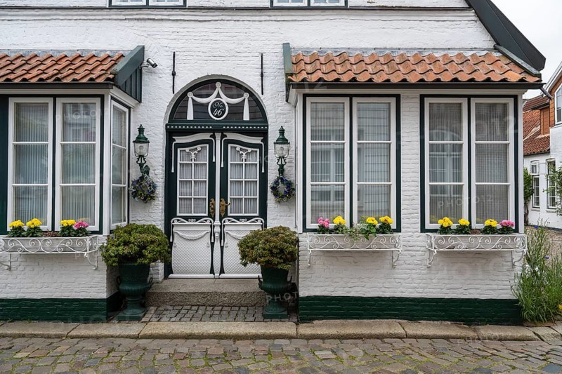 Beautiful ornate door, mullioned window, façade, old town, Husum, North Frisia, Schleswig-Holstein, Germany