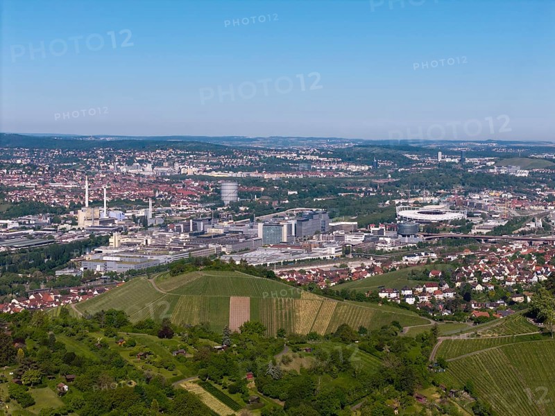 City panorama of Stuttgart with hills and vineyards, in the background the Mercedes-Benz plant in Stuttgart-Untertürkheim and the MHP Arena, Baden-Württemberg, Germany