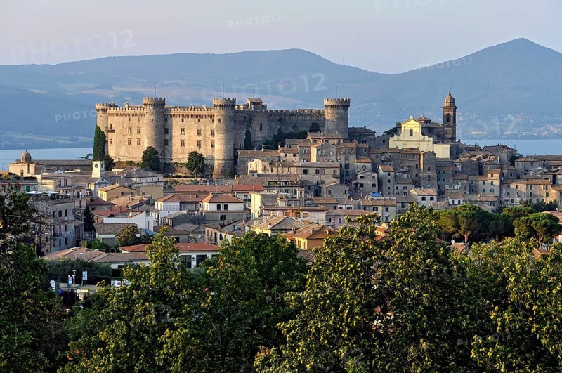 Castello Odescalchi fortress, Duomo Santo Stefano cathedral, behind Lake Bracciano, Lago di Bracciano, old town centre, Bracciano, metropolitan city of Rome, Lazio, Italy