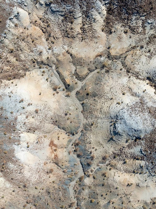 Broken, rocky ground with sparse vegetation. Aerial view. Drone shot. Southern Namibia