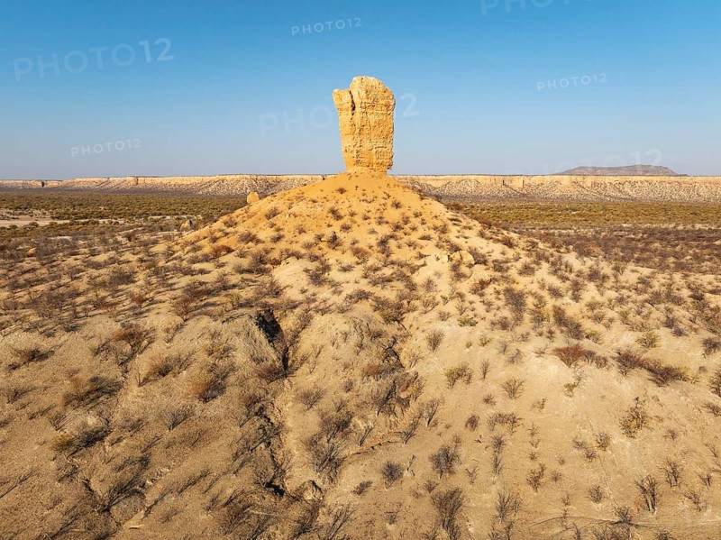 The Vingerklip (rock finger) and the Ugab Valley Terraces are surrounded by thornbush and mopane (Colophospermum mopane) savanna. Aerial view. Drone shot. Damaraland, Namibia