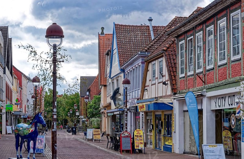 Buildings and shops in Lange Straße in the historic old town centre of Nienburg an der Weser. Nienburg, Lower Saxony, Germany