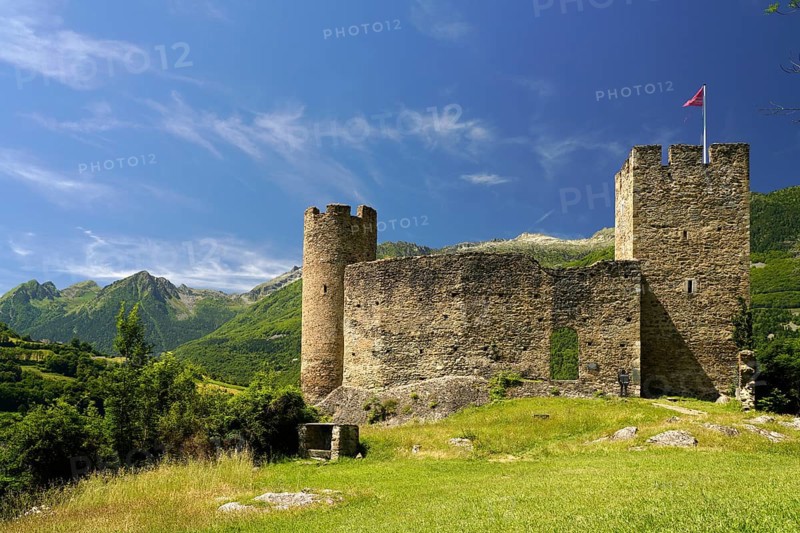 The ruins of the Château Sainte-Marie castle in Esterre and the mountain landscape near Luz-Saint-Sauveur, Pyrenees, France
