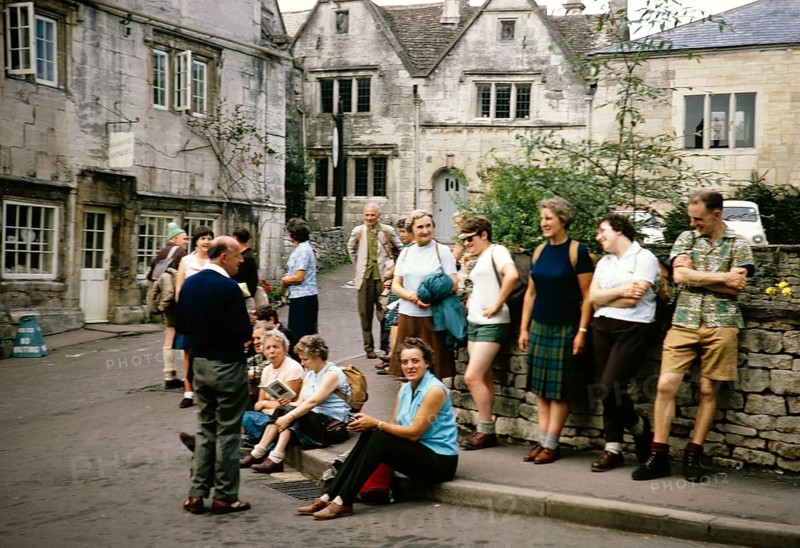 Group of ramblers meet together in town centre, Painswick, Gloucestershire, England, UK 1967