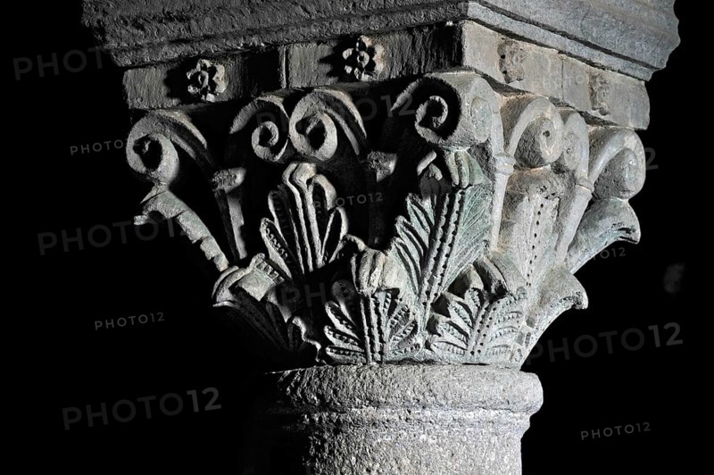 Column capitals with plants, flora, relief in stone, underground grove of columns, pagan crypt, 10th century, gloomy illumination, Cathedral of Acquapendente, Basilica of the Holy Sepulchre, Basilica Santo Sepolcro, Basilica minor, Aquapendente, Province of Viterbo, Lazio, Italy