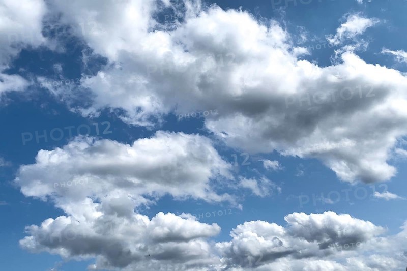 White clouds Altocumulus in front of blue sky. international