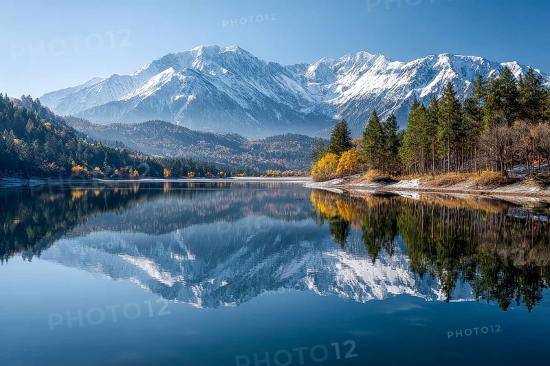 Alpine snow-peaked mountain landscape with trees reflecting in the water of pristine lake, AI generated