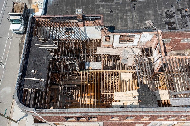 Detroit, Michigan - Workers rehab a long-vacant and crumbling commercial building in the Morningside neighborhood. The project, called Ultreia, will contain first floor commercial space and apartments above