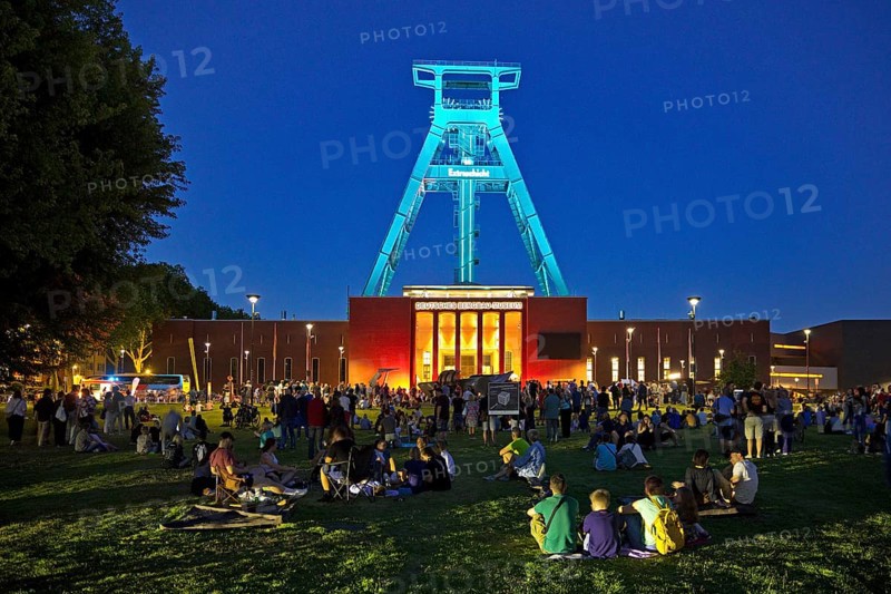 People in front of the German Mining Museum for the Extra Shift at night, Bochum, Ruhr Area, North Rhine-Westphalia, Germany