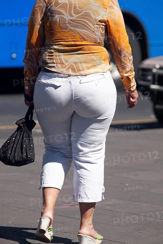 Woman walking in the street, From behind, Obesity, City of Quito. Pichincha province, Ecuador, South America